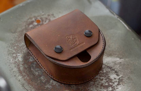 Leather fly fishing reel holder from Dead Miners Handmade Goods, Keweenaw Peninsula, Michigan