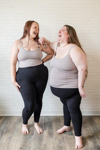 Two women wearing pumping and nursing tops