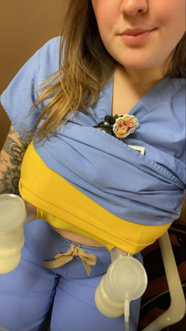 Woman in scrubs and a davin and adley Amelia cami using a breast pump.