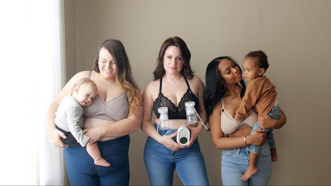 Three women. Ine is holding a baby. Another is using a breast pump. The third mom is holding a toddler. They are all wearing Davin & Adley bras.