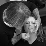 Maya Sialuk Jacobsen, an Inuit tattoo artist, doing traditional face tattoo