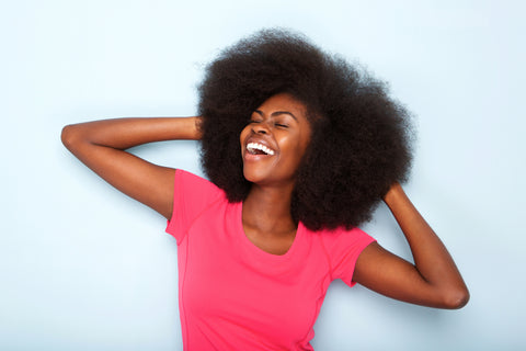 Picture of black woman with healthy low porosity afro hair