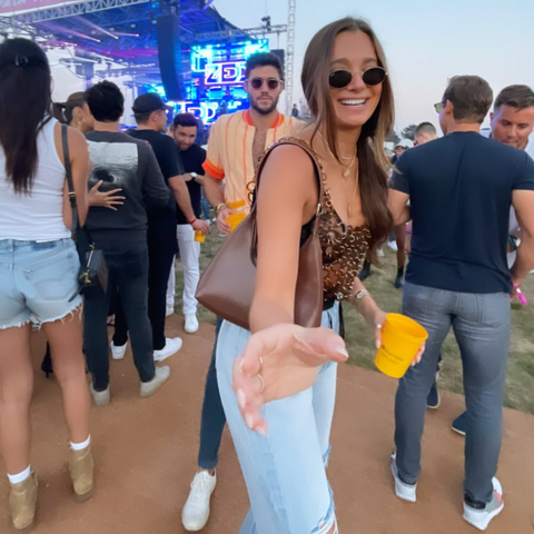 @weworewhat wearing the Bob Oré Alexia leather bag in caramel at the Coachella Music Festival