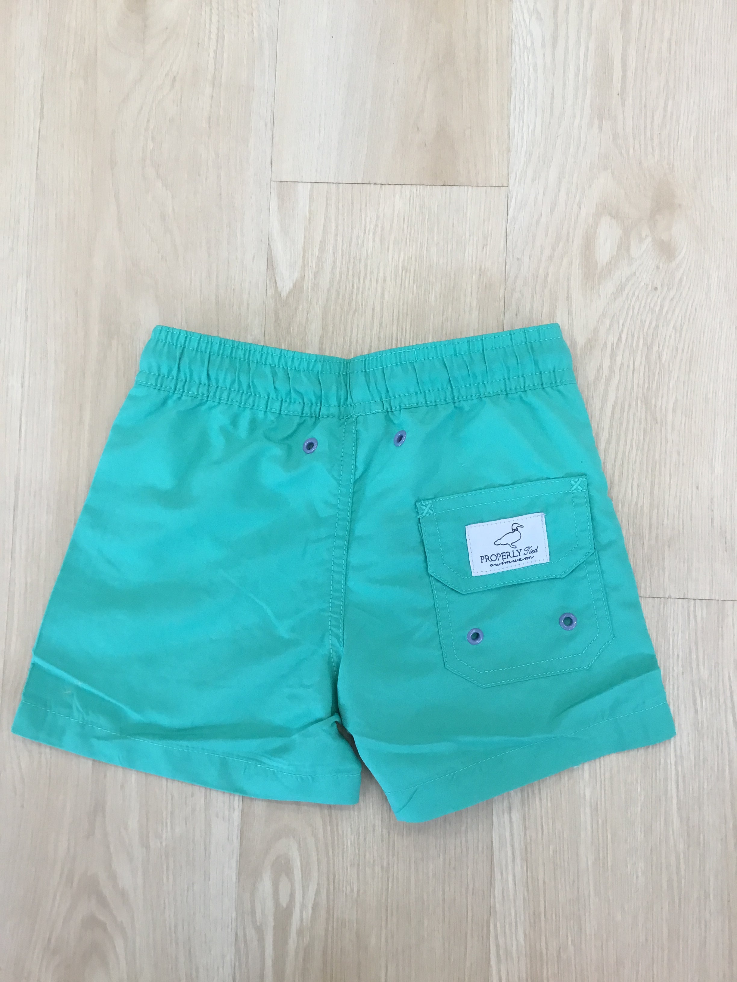 SOFT GREEN SWIM TRUNKS – Clara James Children's Boutique