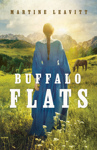 The cover of Buffalo Flats. The cover features a photo of a young woman from behind wearing a long blue dress in the late 1800's style. Her hair hangs in a long braid down her back and she is walking in a grassy field with mountains and a grazing horse in the distance.