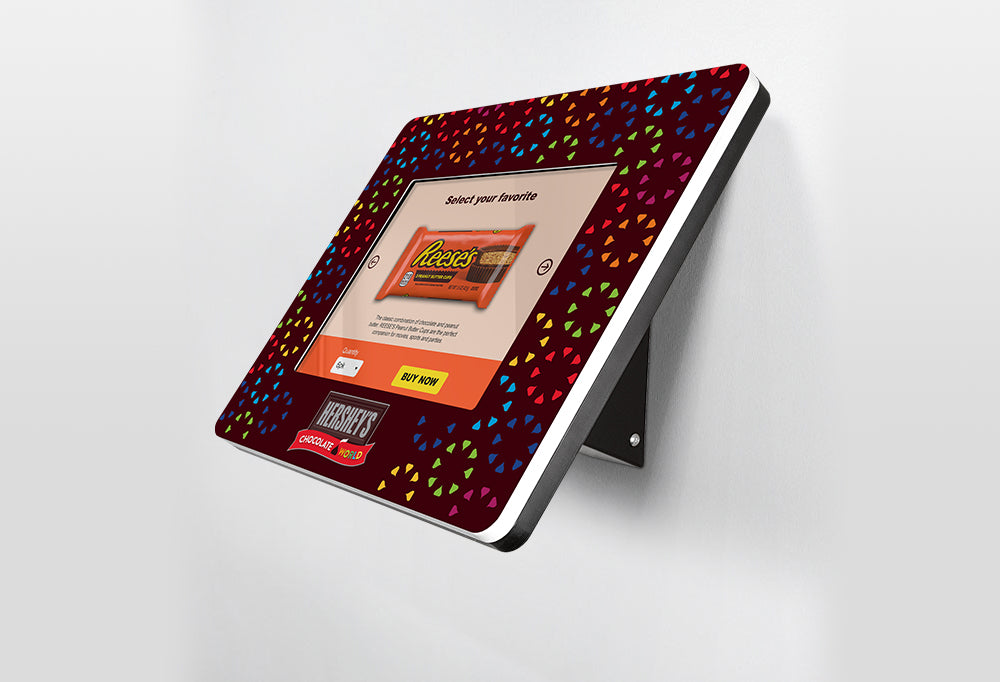 A bezel graphic surrounds the frame of the tablet kiosk screen.