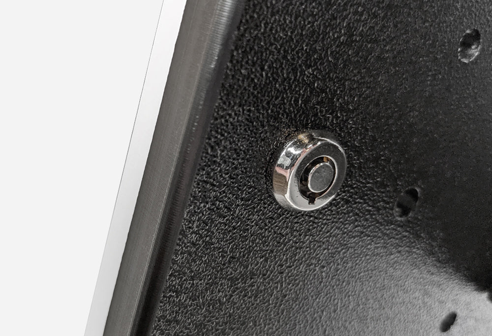 A closeup of the barrel lock that secures the tablet within the enclosure.