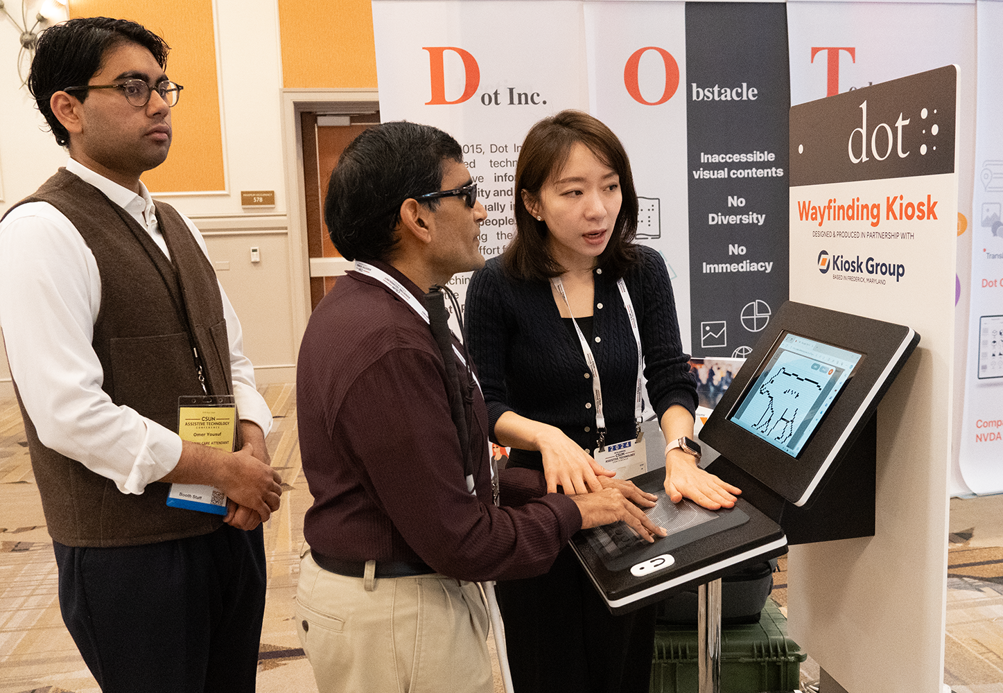 visitor interacting with Dot Kiosk at CSUN Assistive Technology Conference 2024