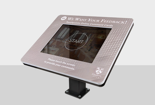 A slim countertop kiosk mount with a bezel graphic encouraging visitors to provide feedback.