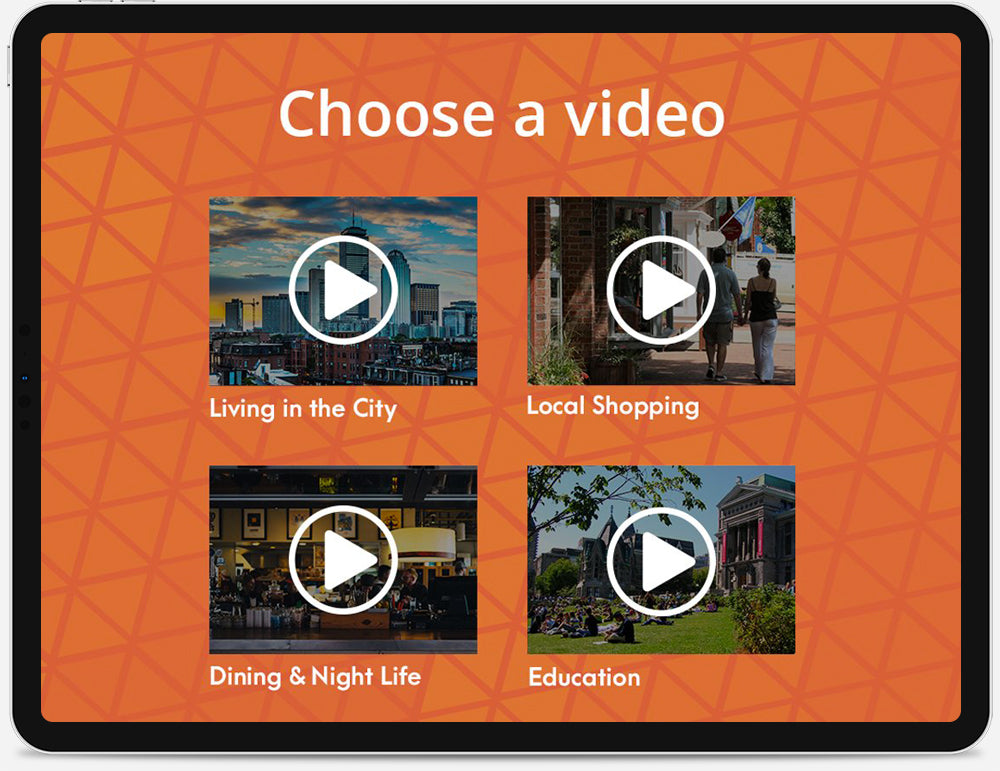 An iPad displaying a menu of video thumbnails.