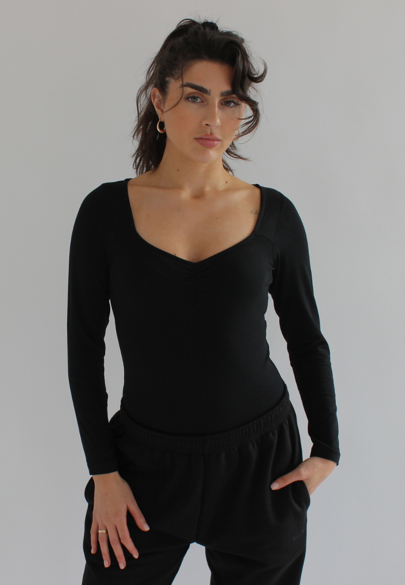 Long sleeve shapewear bodysuit, neckline is finished with a