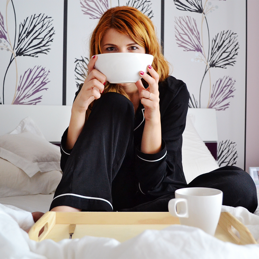 Girl eating in bed