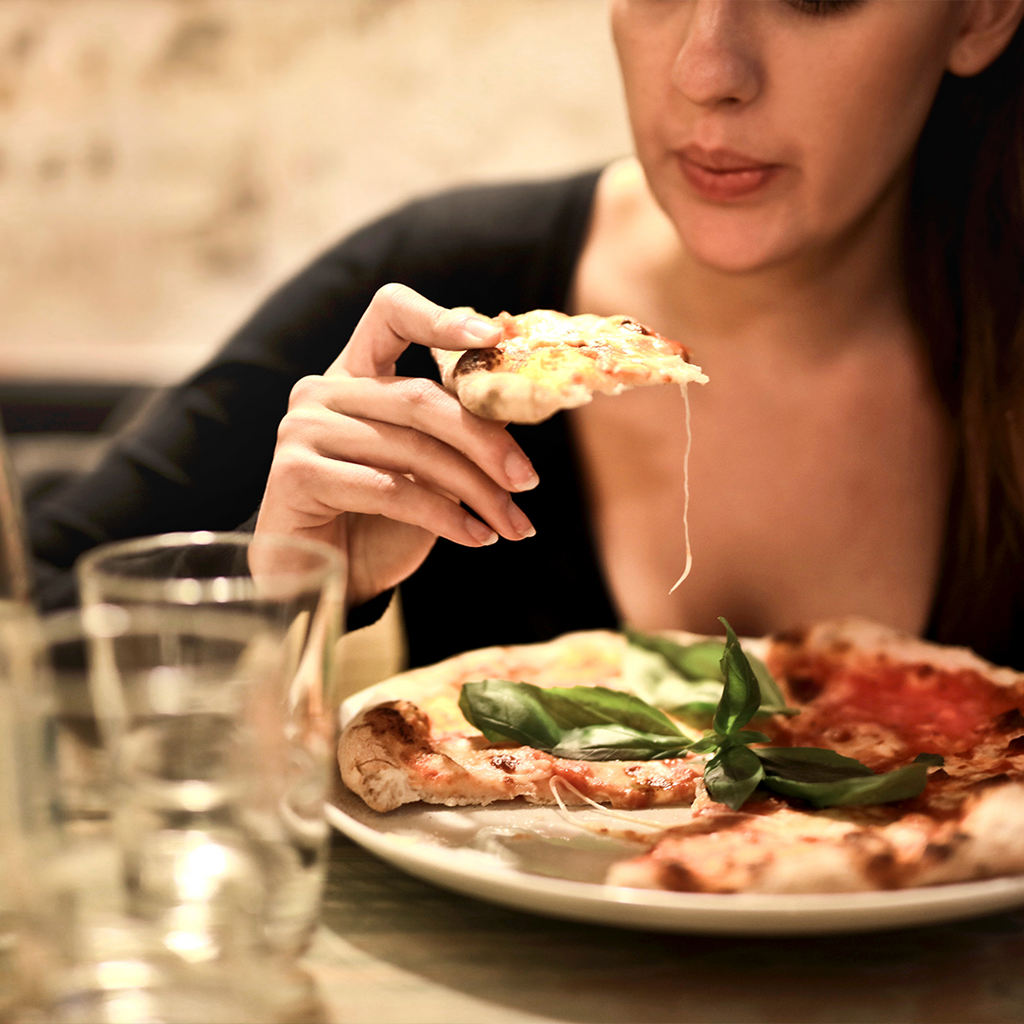 Girl eating pizza