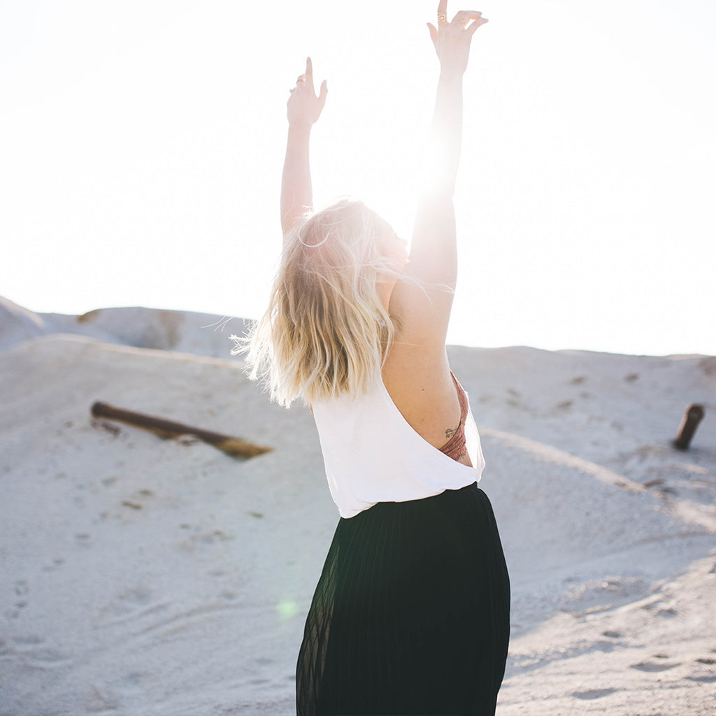 Girl standing in sunlight