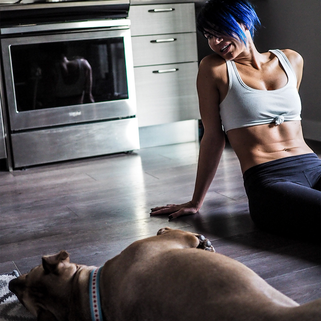 Girl laying down with dog