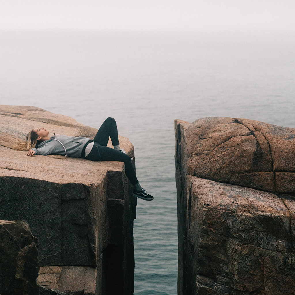 Woman laying on a rock