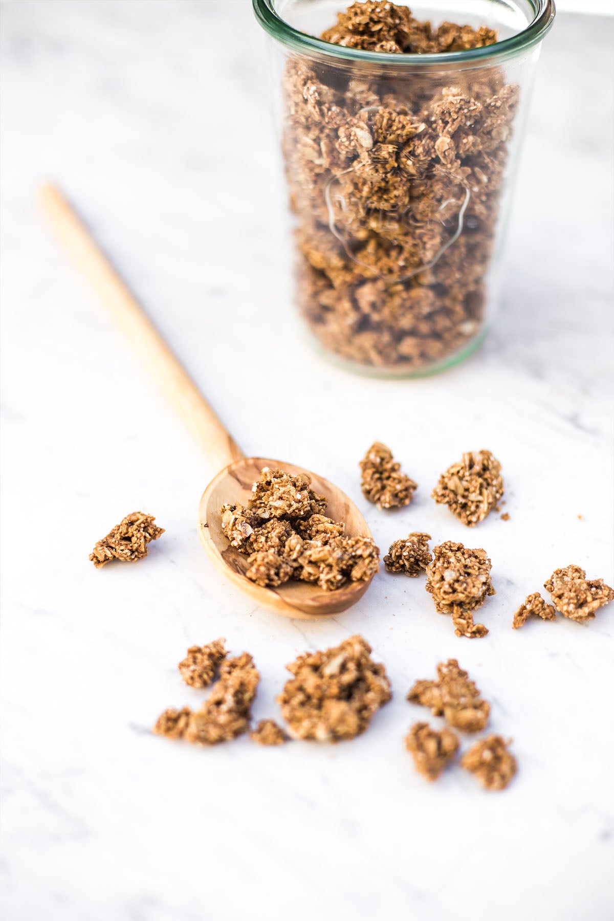 granola on wooden spoon