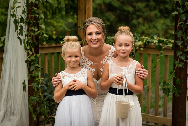 Ana Balahan Roselle light ivory lace flower girl dress with V-neck on the back