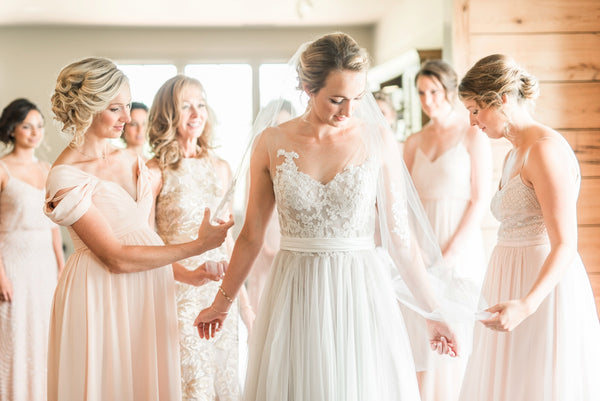 Bride with Bridesmaids wearing unique style dresses in light blush colors virginia wedding