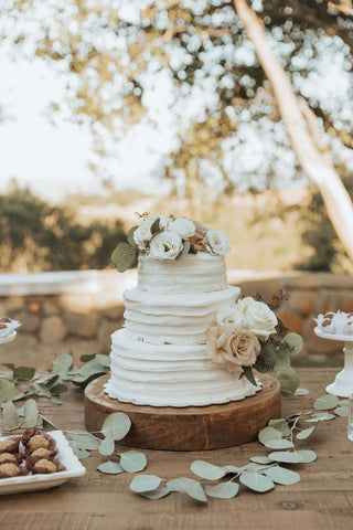 Three tier rustic wedding cake with fresh flowers Melbourne