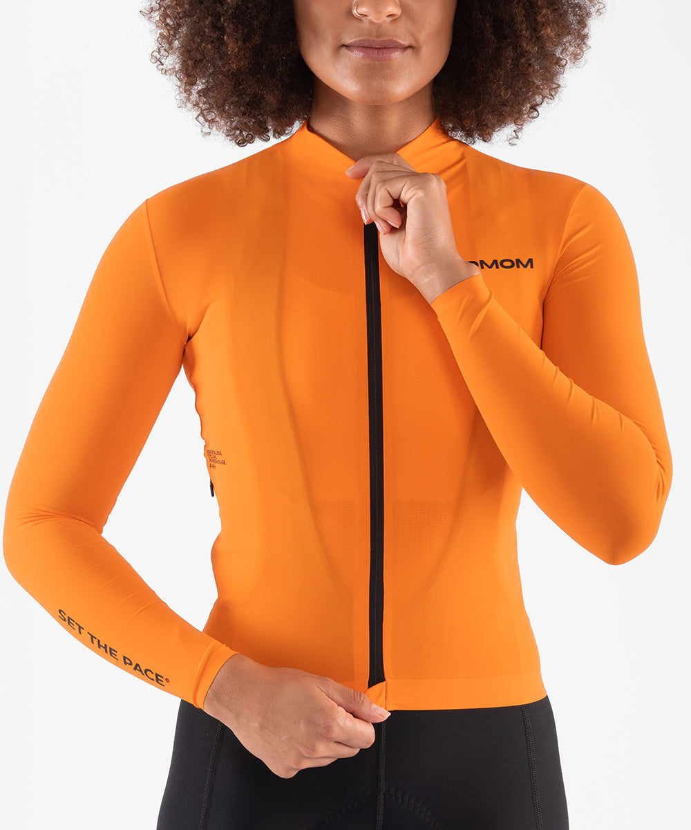 product_womensallaroundlsjersey_sunsetorange_studio_01.jpg__PID:9504f5fb-0002-4a85-b026-2688ec604c4c