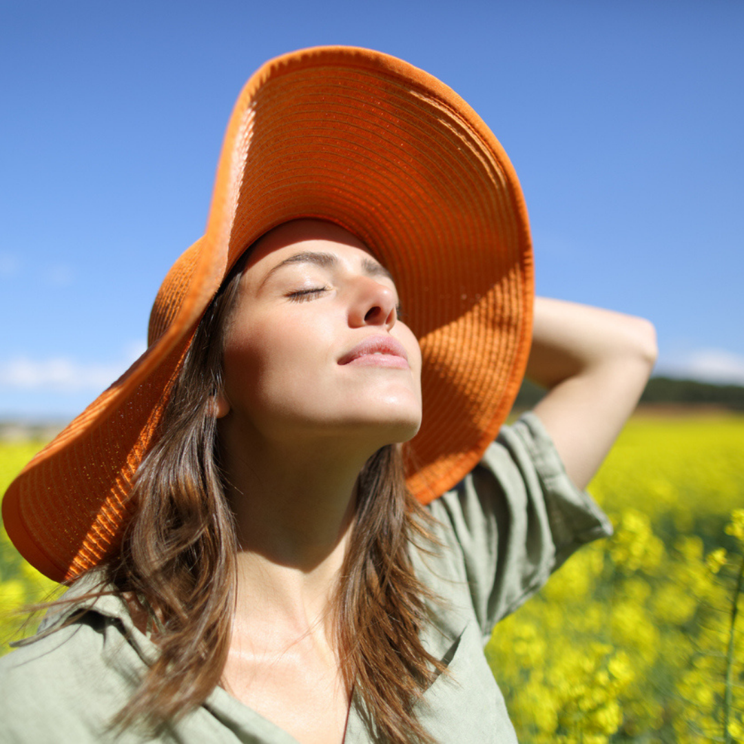 lady breathing easily in open air with hat on