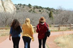 Three girls walking together.