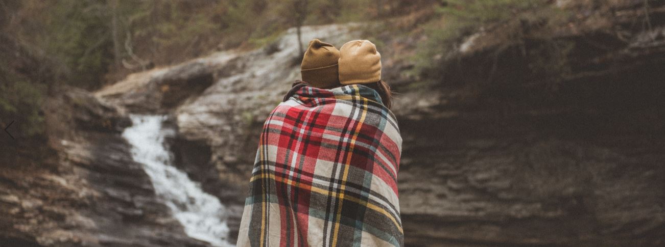 Couple wrapped in plaid