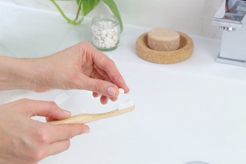 bamboo toothbrush with a toothpaste tabs from beewise