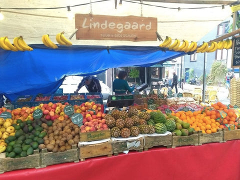 a farmer's market showing fruits 