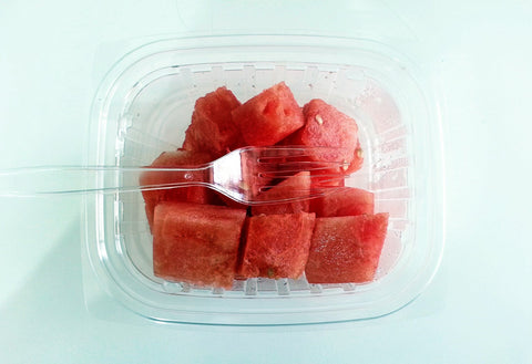 plastic container with fruits inside