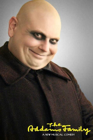 Uncle Fester from Addams Family with white face and dark undereyes