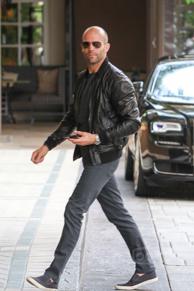 JASON STATHAM walking in the streets in leather jacket and fashion sunglasses