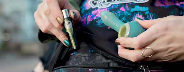 Woman pulling Kasher Lighter Tool Out Of Backpack