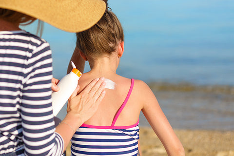Family applying sunscreen sun block sun protection summer