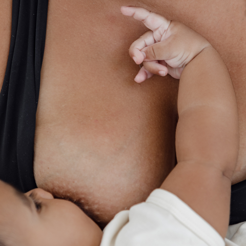 A close up of a breastfeeding baby. There are few breastfeeding essentials for babies needed to start the process. 