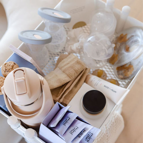 A kit of breast care products ready for a breastfeeding mum. It includes a manual breast pump for expressing breastmilk, nipple shields for nipple protection, nipple balm, and hot and cold compresses for treating sore breasts.