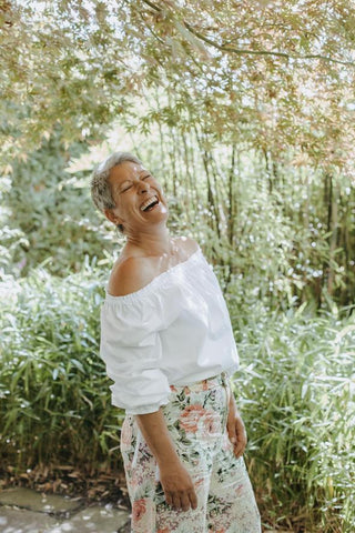 White off-the-shoulder blouse.