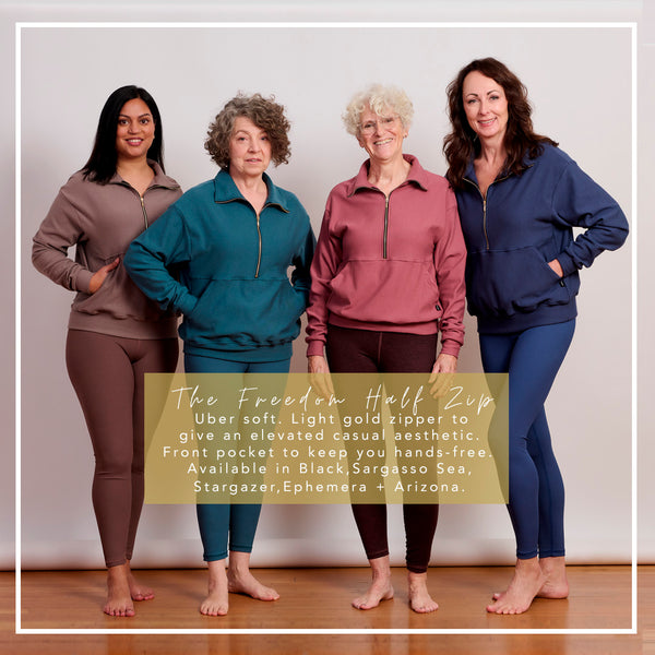 A group of 4 women of all ages wear DAUB. They all have on a half zip crewneck sweatshirt made from bamboo cotton fleece with a light gold zipper.