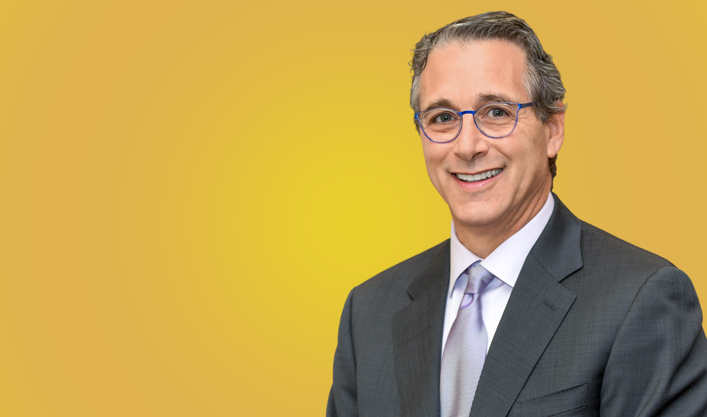 Dr. Paul Krawitz portrait on yellow background