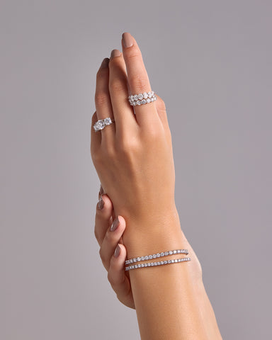 Woman's hand adorned with Artelia diamond rings