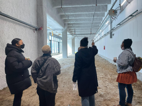 Tracy Reese (third from the left) and members of the Hope for Flowers team, visiting the studio during the fall of 2022, while it was still under construction.