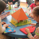 kids build cube house with pyramid roof