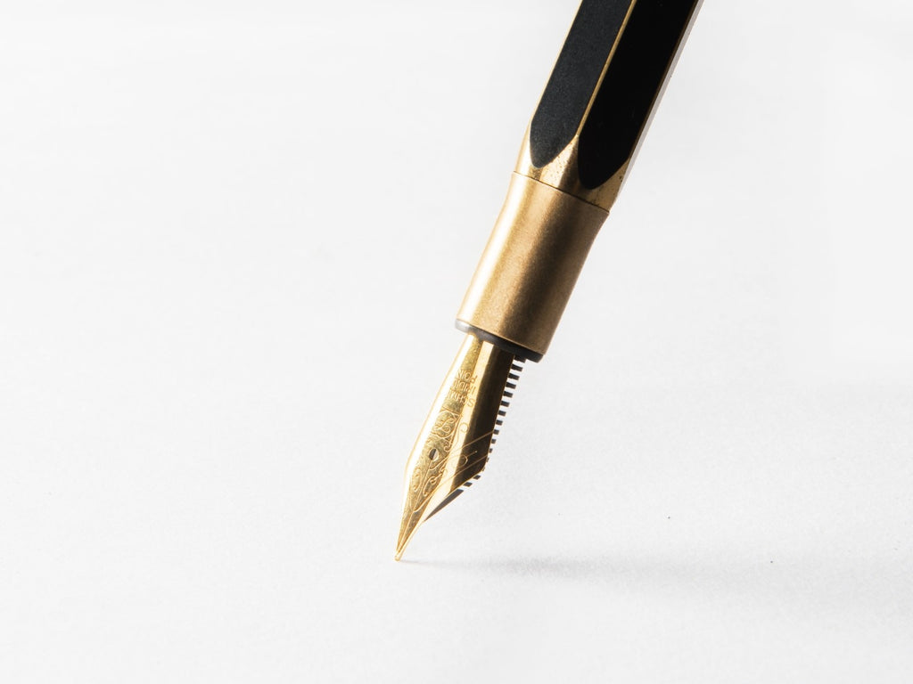 The fountain pen feed is a slender, often hidden component beneath the nib.
