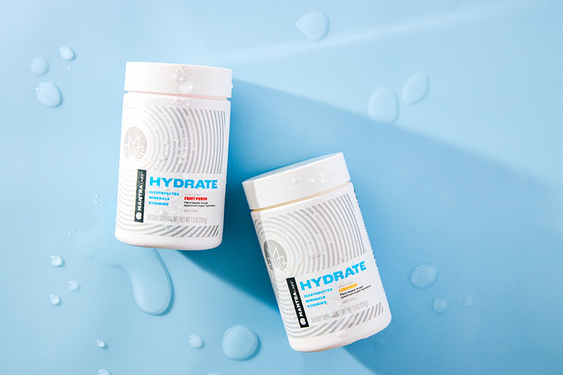 Two MANTRA Labs HYDRATE electrolyte drink mixes.