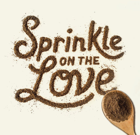 The words "sprinkle on the love" written in supplement powder with a spoon at the end. 
