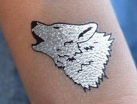 silver and red wolf tattoo