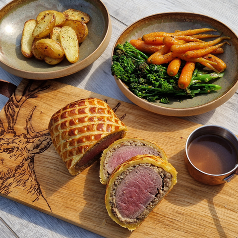 venison wellington with carrots and roast potatoes