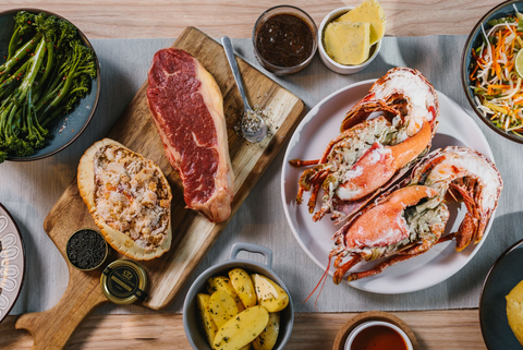 best of land and sea box ingredients laid out on a dining table