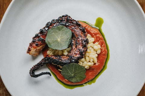 octopus with burnt tomato and barley